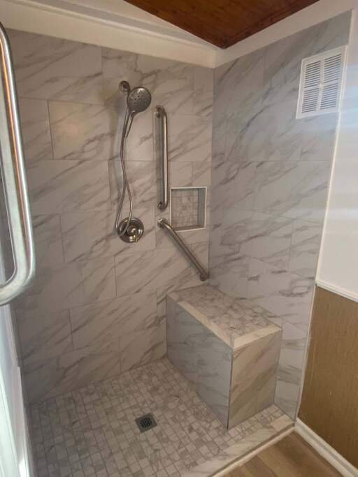 Aging in place bathroom design for showers with grab bars placement. Schedule a free consult today.