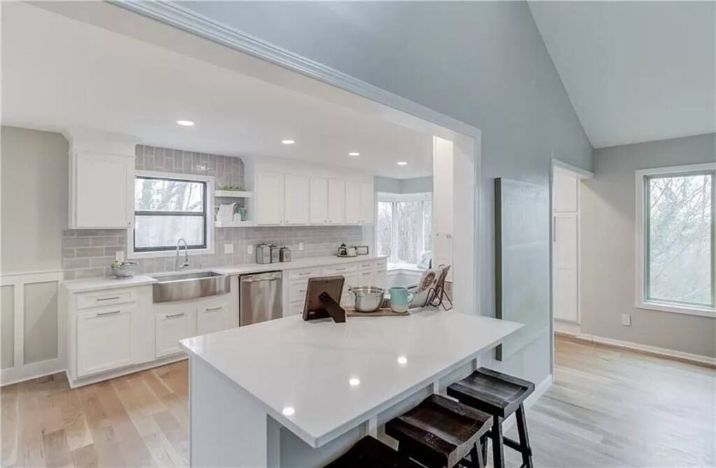 Kitchen remodel detail showing island, countertop, and cabinet finish