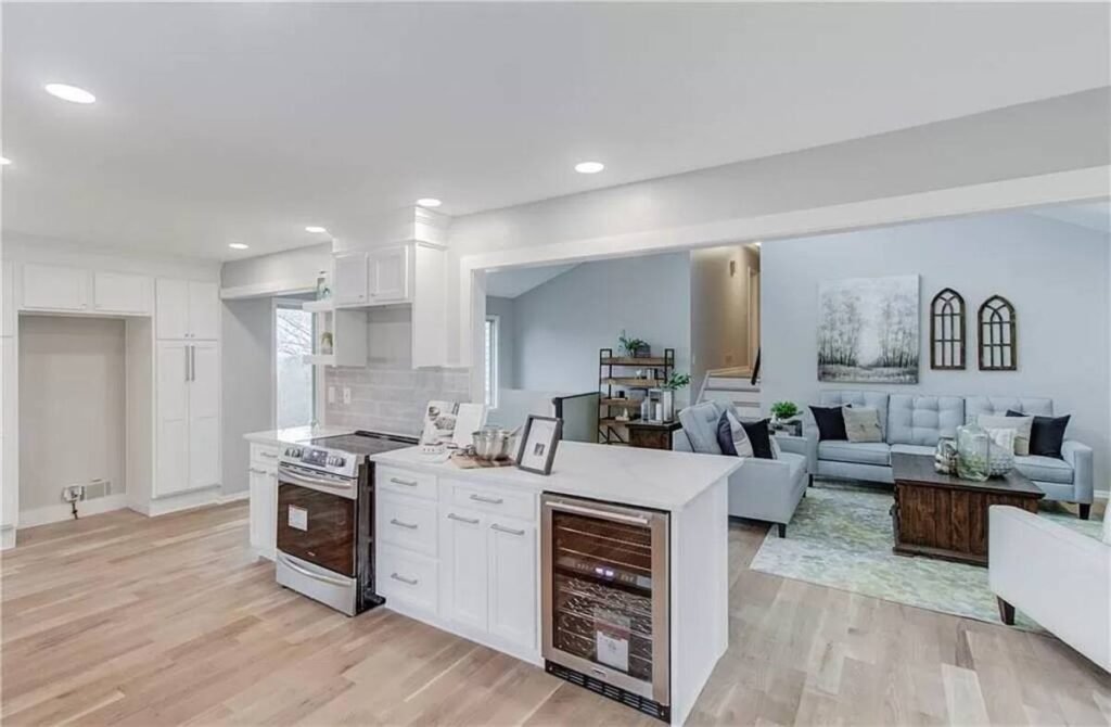 Kitchen remodel detail with white cabinets, recessed lighting, and clean lines