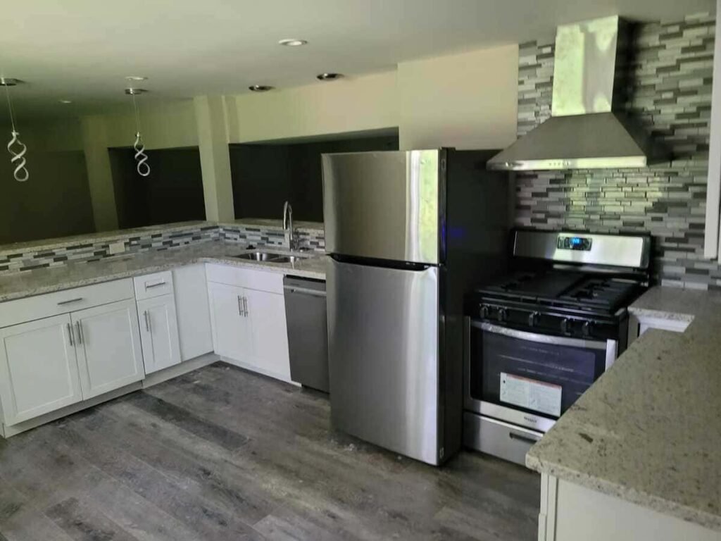 Finished kitchen remodel showing cabinetry and countertop workspace