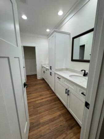 Finished bathroom remodel in Mountain Brook 35223 with long double vanity and custom cabinetry