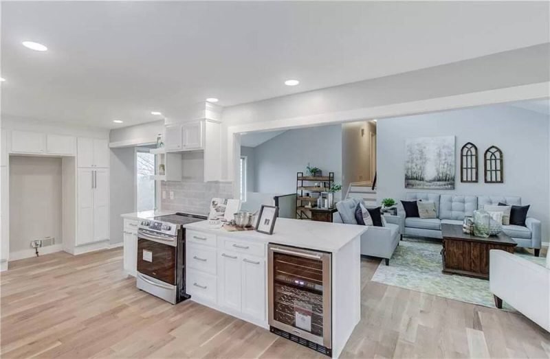 Kitchen remodel detail with white cabinets, recessed lighting, and clean lines